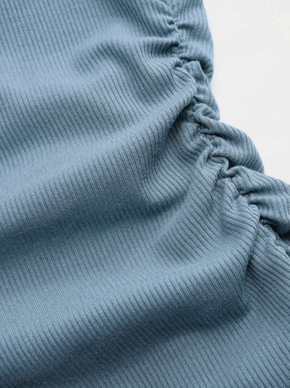Top Asimmetrico: l'eleganza che valorizza