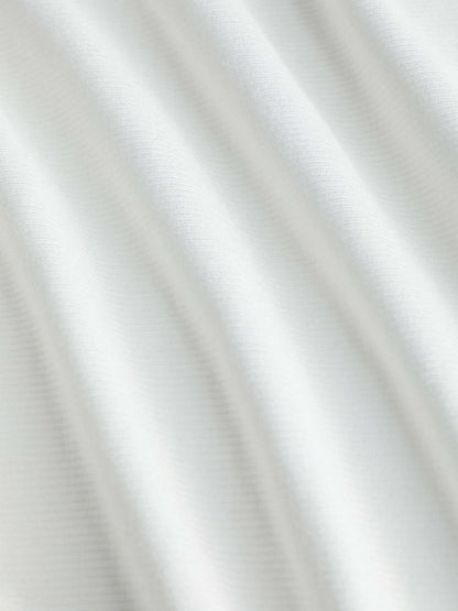 Top Asimmetrico: l'eleganza che valorizza